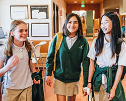 Middle school students walk through the hallways.